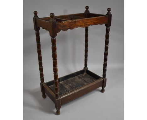 An Edwardian Oak Three Division Stick Stand with Metal Drip Tray, 47cms Long 