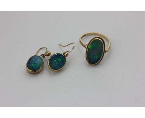 An opal ring in 9ct gold, and a pair of opal drop earrings