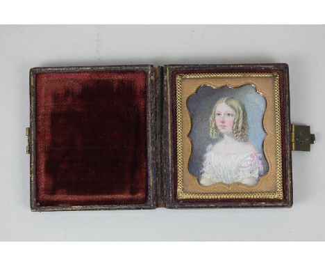 A Victorian miniature portrait of a young girl with blond ringlets and blue eyes, dressed in white, 5cm by 4cm, in leather ca