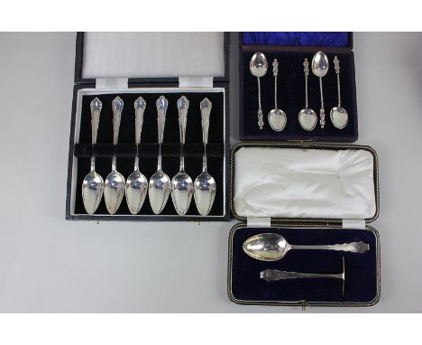 A George V cased silver christening set comprising spoon and pusher, Sheffield 1931, and a cased set of five Victorian silver