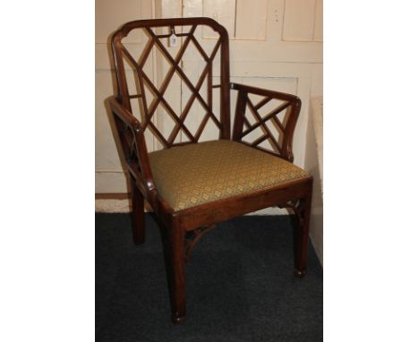 A Chinese Chippendale style carver dining chair, with lattice design back and arm supports, drop in seat, on square chamfered