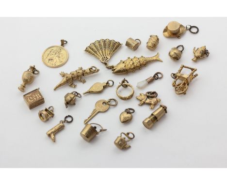 Twenty-three 9ct gold charms, and an opal charm, 46g weighable