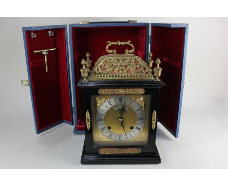 An Elliot and Co London ebonised bracket clock with eight day striking movement, 6 inch dial and silvered chapter ring, gilt 