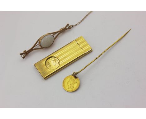 An opal bar brooch in 9ct gold, a gold coin stick pin, and a gold plated cigar cutter