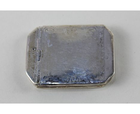 A white metal snuff box of octagonal form with worn engraved design, silver marks worn, probably 18th/19th century, 5.5cm hig