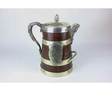 A late Victorian plate mounted wooden trophy tankard with porcelain liner, mask spout, acorn finial, and leaf scroll handle i