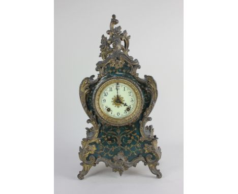 An Ansonia Clock Co American Louis XV style gilt metal mounted mantel clock with enamel dial and Arabic numerals, in gilt and