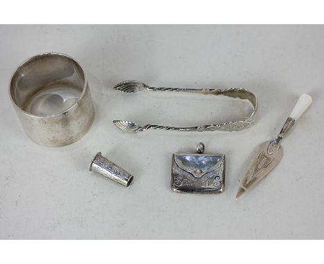 An Edwardian silver stamp box modelled as a bag, Birmingham 1906, together with a silver and mother of pearl trowel page mark