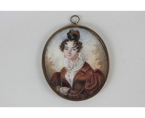 A 19th century oval miniature portrait of a lady with brown ringlets and a high topknot, dressed in frilled blouse and dark r