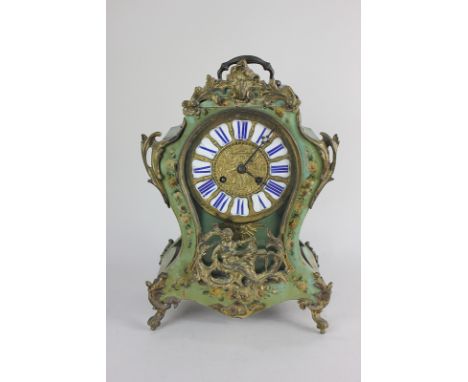 A 19th century gilt metal mounted Louis XV style mantel clock with brass dial and blue and white enamel numerals, movement st