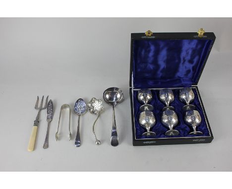 A cased set of six silver plated liqueur goblets, together with a silver plated sauce ladle, sifter spoon, caddy spoon and ot