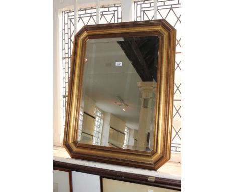 A giltwood rectangular framed wall mirror with bevelled glass, 90cm
