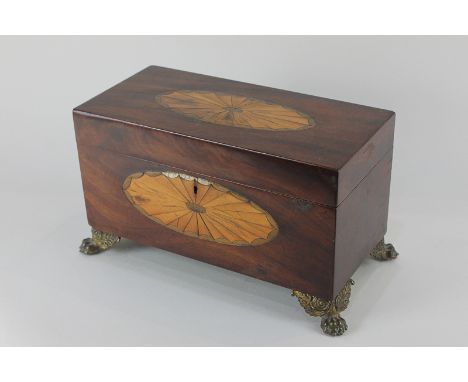 A George III mahogany tea caddy, the top and front inlaid with oval batwing paterae, on brass paw feet, 29.5cm, (a/f)