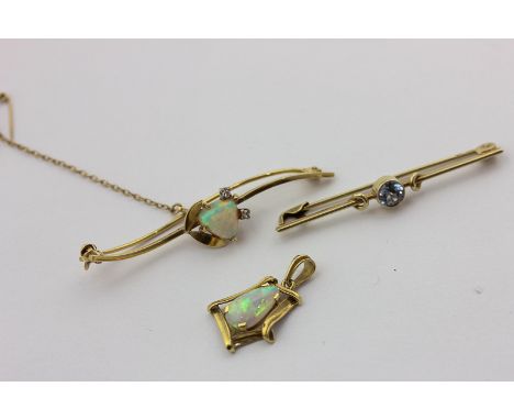 An opal and diamond bar brooch, an opal pendant, and a blue zircon bar brooch