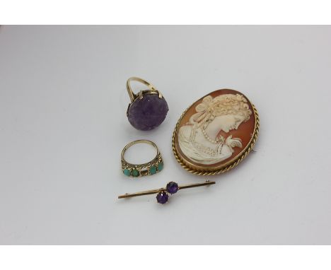 A carved amethyst dress ring in 9ct gold, a turquoise ring (a/f), a shell cameo brooch, and an amethyst two-stone bar brooch