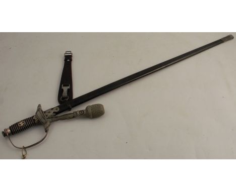 A German Third Reich sword, with SS motif to the grip, the blade marked&nbsp; Pet Dan Krebs Solingen, in a metal scabbard, to