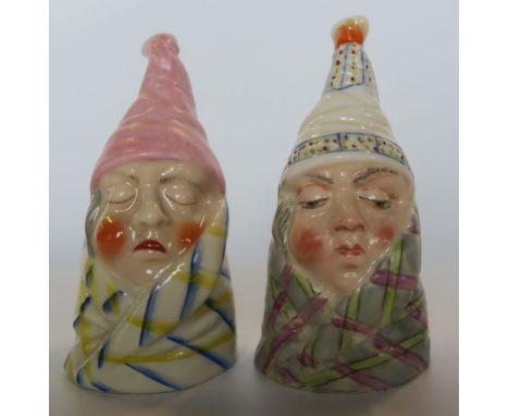 Two Royal Worcester candle snuffers, modelled as Caudle, in different colourways - One with pink cap restored