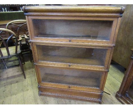 A light oak Globe Wernicke three section glazed oak bookcase, width 33.5ins, x depth 11ins x height 45ins