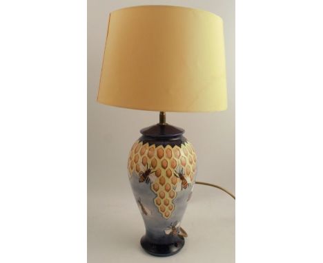 A Moorcroft pottery table lamp, the baluster shaped body decorated in the Honeycomb pattern, height including shade 22ins - G