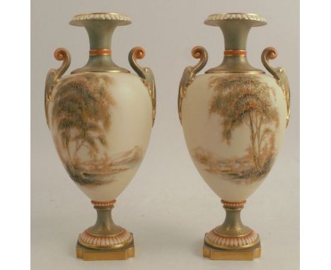 A pair of Royal Worcester pedestal vases, decorated with landscapes of trees, water and mountains, shape number 1969, height 