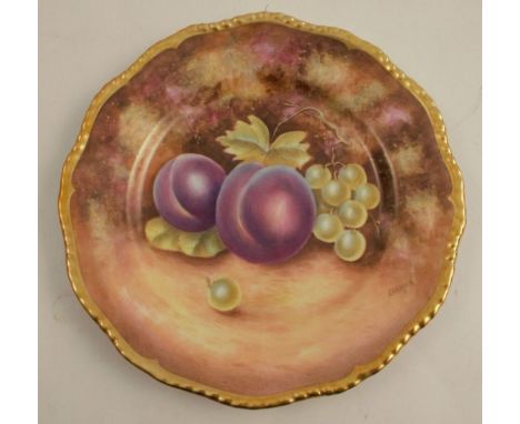 A Royal Worcester side plate, with a gadroon border decorated with fruit by Leaman, diameter 6.75ins - Good condition