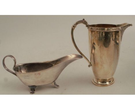 A silver jug, decorated with a narrow band of Celtic style symbols, Birmingham 1937, weight 4oz, together with a silver plate