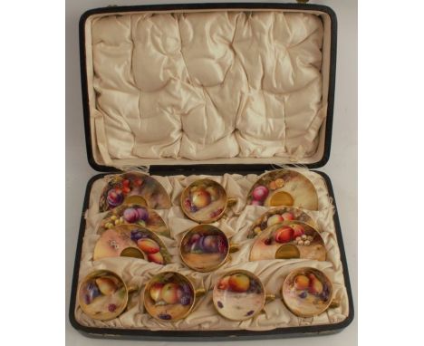 A cased set of Royal Worcester miniature cups and saucers, the cups decorated to the inside with hand painted fruit by variou