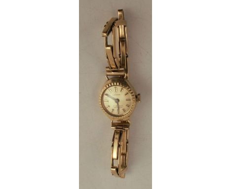 A lady's 9 carat gold Carronade mechanical wrist watch on a bracelet