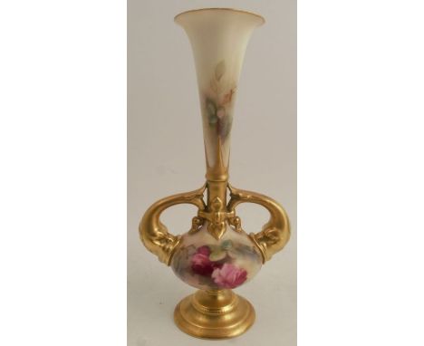 A Royal Worcester vase, decorated with red roses, with gilt fish handles, on a gilt pedestal foot, shape number 1749, height 