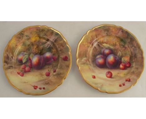 Two Royal Worcester plates, decorated with hand painted fruit to a mossy ground by Horace Price, diameter 9ins, both signed, 