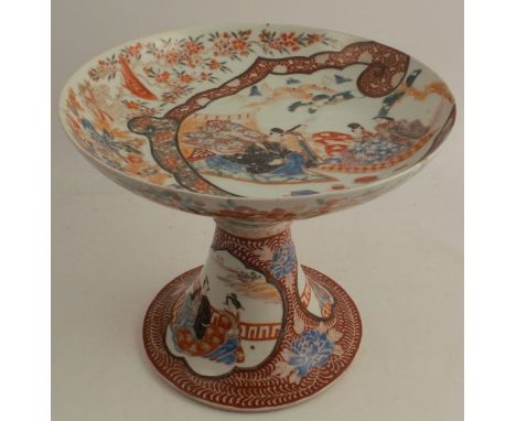 An antique Kutani porcelain tazza, decorated all over with cockerels, birds and flowers, two panels of figures to the base, a