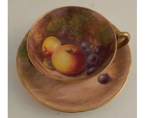 A Royal Worcester tea cup and saucer, the interior of the cup and saucer decorated with hand painted fruit by Maybury - Sauce