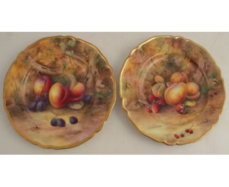 Two Royal Worcester plates, decorated with hand painted fruit to a mossy ground by Horace Price, both signed, diameter 9ins, 