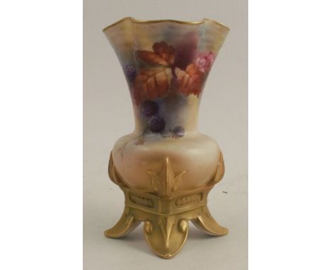 A Royal Worcester vase, with shaped flared neck, decorated with autumnal fruits and leaves, raised on four feet, shape number