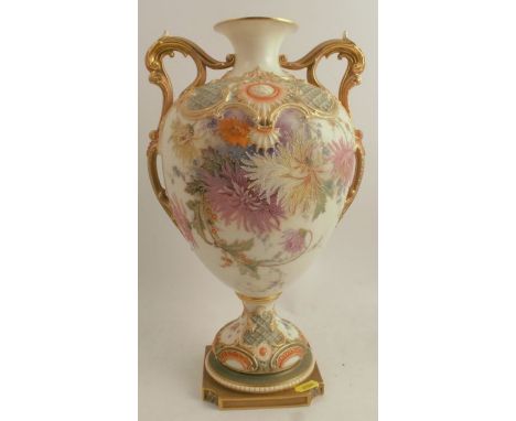 A Royal Worcester two handled vase, having moulded part lattice body decorated with chrysanthemums, raised on a rebated squar