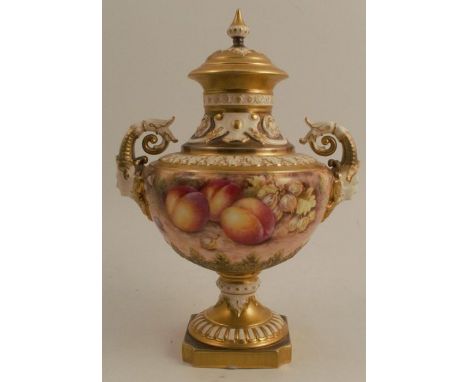 A Royal Worcester covered pedestal vase, decorated all round with hand painted fruit by Freeman, with mask handles, shape num