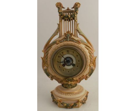 A Royal Worcester blushed ivory lyre shaped mantle clock, with a garland of acorns above green leaf handles, shape number 138