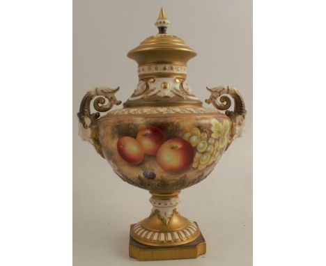 A Royal Worcester covered vase, decorated all round with hand painted fruit by Leaman to a mossy background, with mask scroll