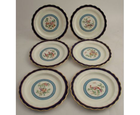 A set of six Royal Worcester cabinet plates, for Tiffany New York, painted to the centre with Asiatic birds in a leafy tree, 