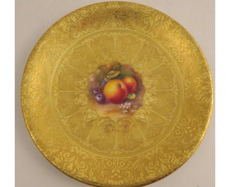 A Royal Worcester acid gilt plate, painted to the centre with fruit by H Price, signed, diameter 9.25ins - Good condition