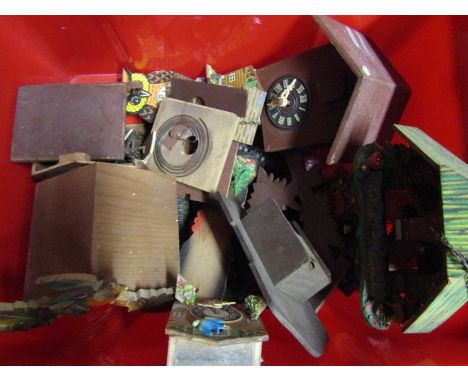 A box of 20th Century cuckoo clock parts and spares