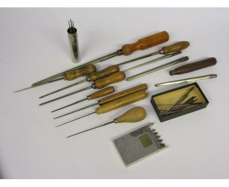 An assortment of cutting and smoothing broaches of mixed size, with a cased set of double ended roller sinks/oil sink cutters