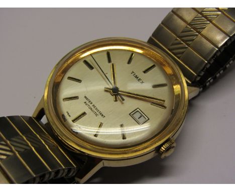 TIMEX: a steel and gold plated cased gent's automatic wristwatch, silvered dial with date and centre seconds, dial numbered 4