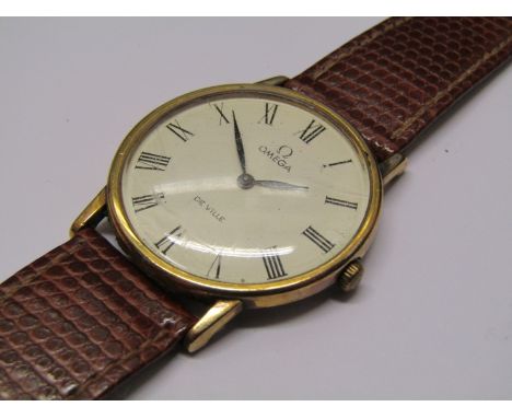 OMEGA: a De Ville gold plated and steel cased gent's manual wind wristwatch, Roman dial, with possibly associated Omega Inter