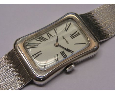 TISSOT: a silver cased manual wind gent's bracelet watch of Art Deco influence, shaped rectagular case with Roman dial, chip 