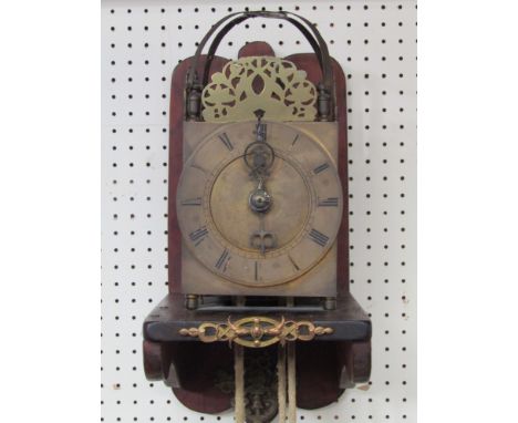 An 18th Century and later lantern clock with 30 hour countwheel strike with rope drive, weight and pendulum, mounted ona  mah