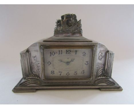 A Tokyo Clock Co. mantel clock, circa 1930-35 in pewter case, clock was awarded to an oustanding worker in a metal more mine 