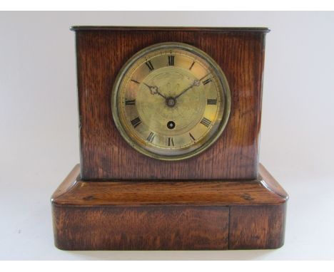 An oak mantel timepiece with French movement and silk suspension, engine turned dial, movement marked O. Berger, Paris, movem