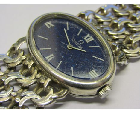 OMEGA: a De Ville silver cased lady's manual wind bracelet watch with suede Omega pouch, lapis oval dial (crazed), calibre 62