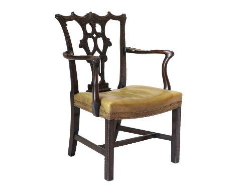 A George III Chippendale-Style Carved Mahogany Open Armchair, circa 1800, recovered in light green close-nailed leather, the 